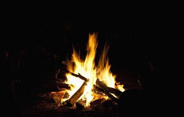 A "war relic" explodes during a campfire lit by children