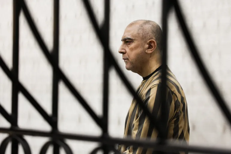 Cousin of toppled Syrian leader faces at least 10 charges in landmark trial