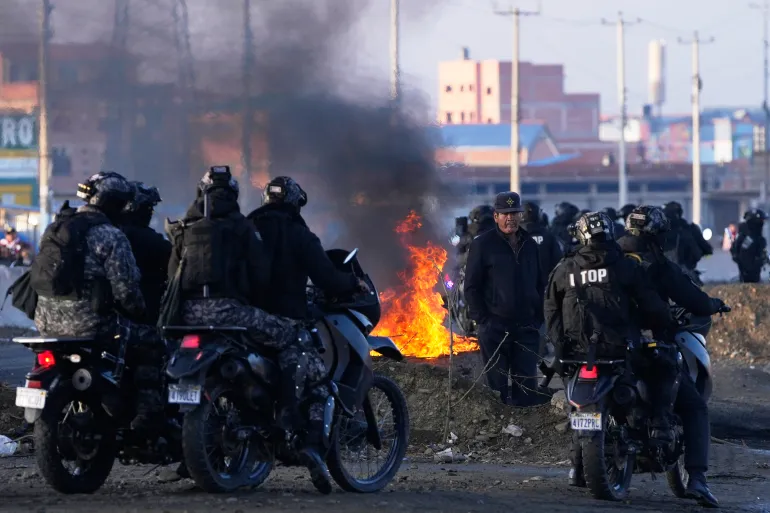 Bolivia’s embattled president says will take a 50 percent salary cut
