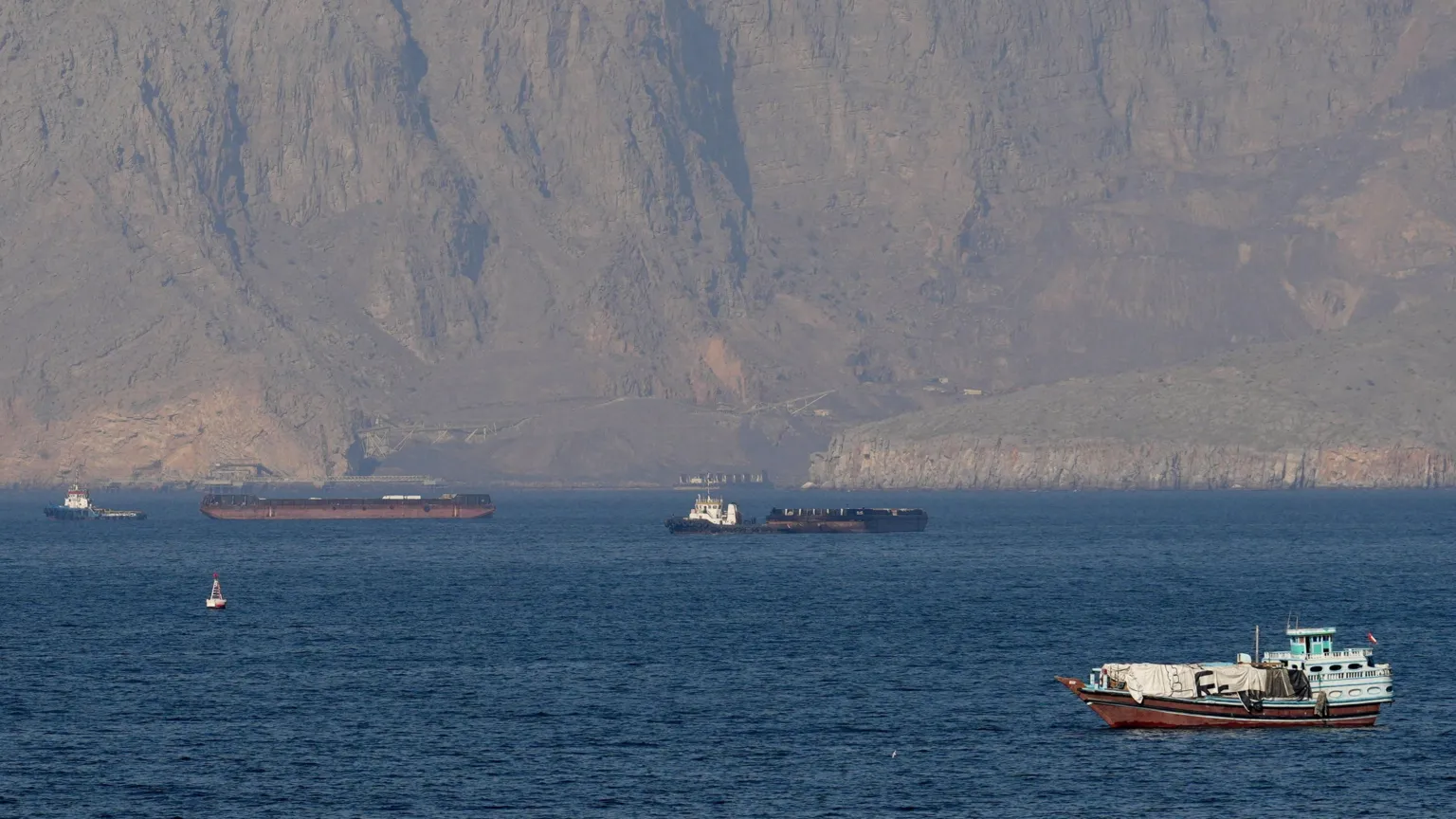 Strait of Hormuz closed again, Iran says, as ships attacked