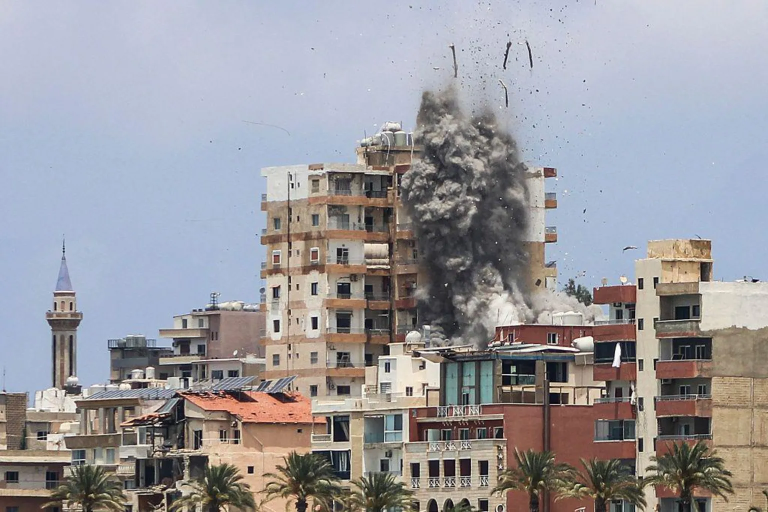 Israeli air strikes hit Lebanese city of Tyre despite Iranian warning to stop attacks