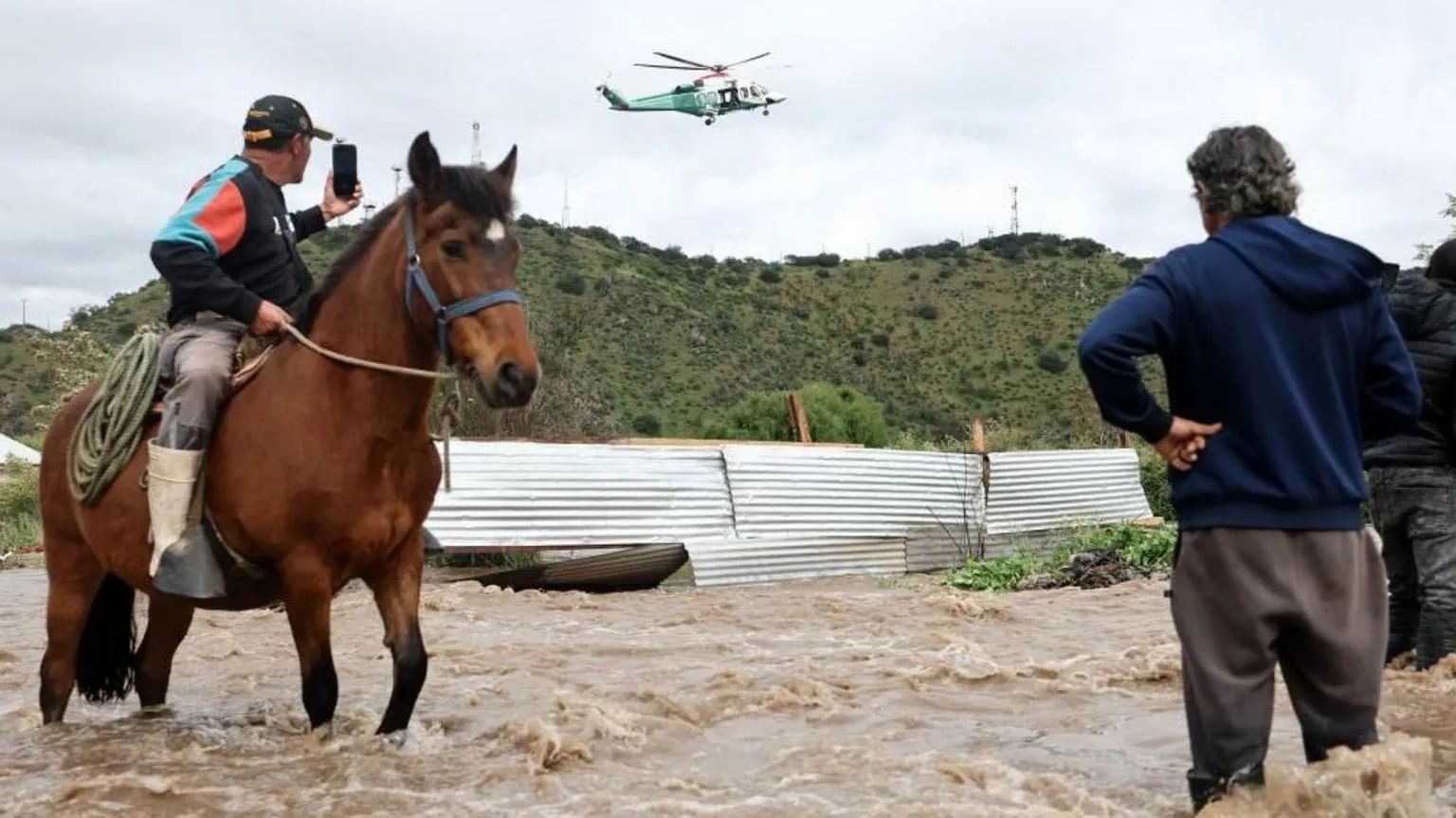 Residents airlifted to safety after flooding in central Chile