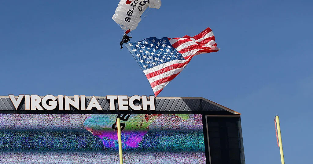 Skydiver rescued after crashing into scoreboard during Virginia Tech game