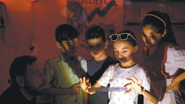 Eight-year-old Zeynep learns photography with mentor Amar Kilic