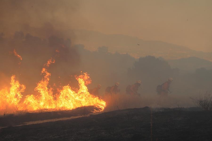 Fast-growing wildfire near US Nevada-California border forces thousands to evacuate