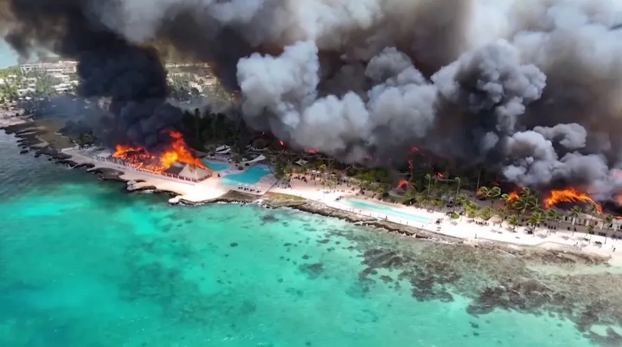 At least one tourist dead after massive fire nearly destroys Caribbean resort; 1,690 evacuated