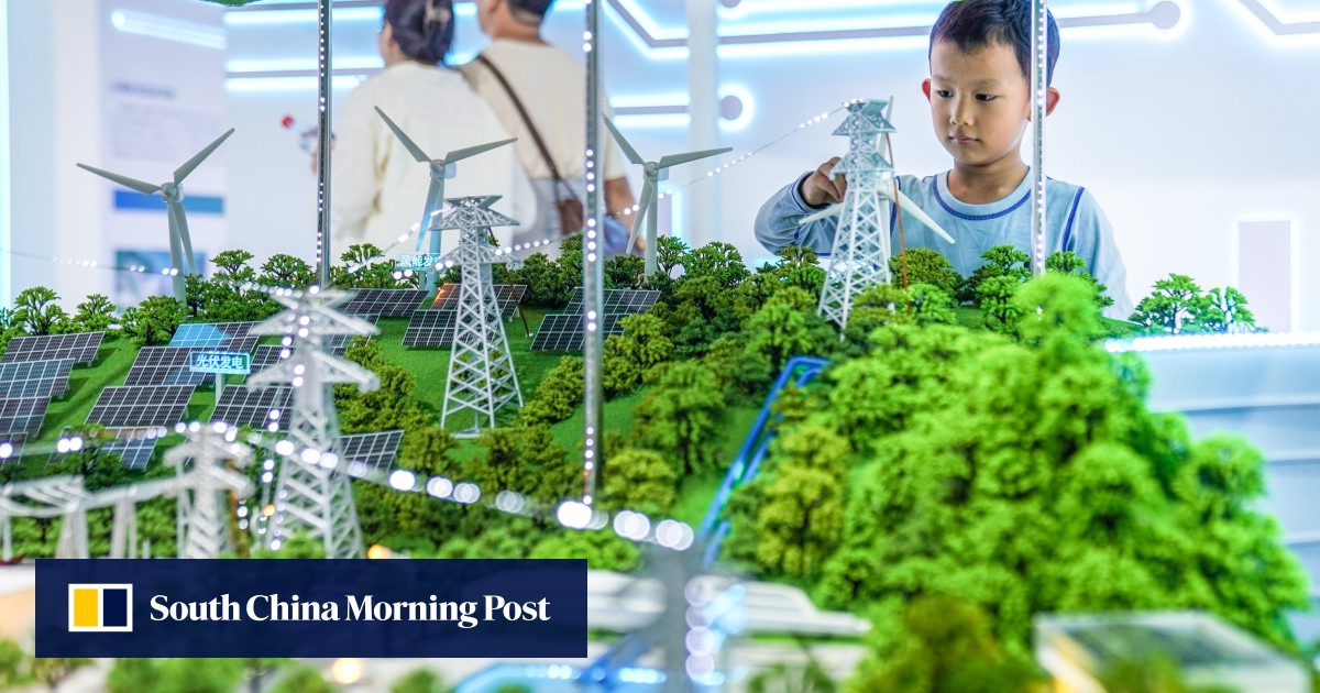 A boy looks at a table demonstrating photovoltaic power generation at the Green Energy Pavilion during the 10th China-South Asia Expo in Kunming, Yunnan province, on June 13.