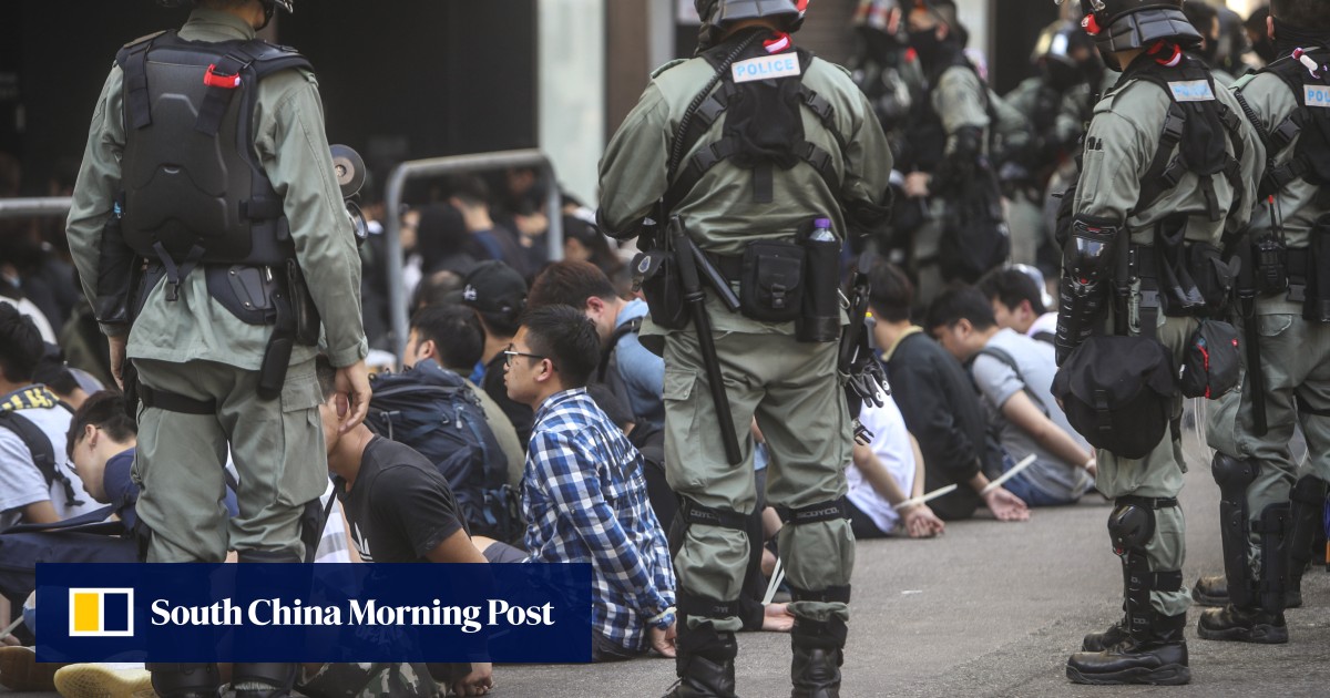 Riot police make arrests after clashes with anti-government protesters at Polytechnic University on November 18, 2019. Photo: Winson Wong