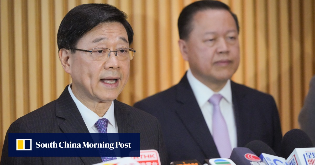 John Lee (left) and University Grants Committee chairman Tim Lui (right). Photo: May Tse