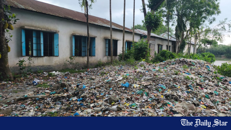 Garbage dump along Kapasia school wall makes attending classes unbearable