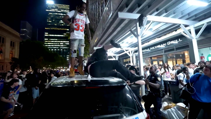 Knicks watch party descends into chaos as New York fans brawl and riot police use pepper spray