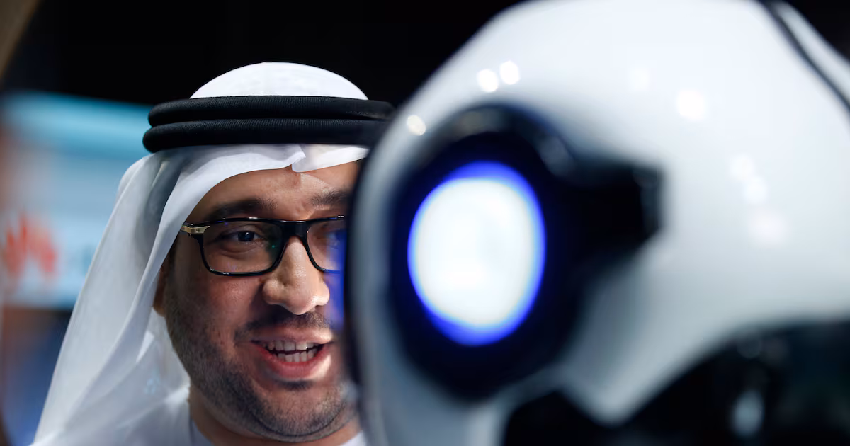 An Emirati man talks to a robot during an exhibition in Dubai. In the new age of competitive advantage of nations, the UAE is now in prime position. EPA