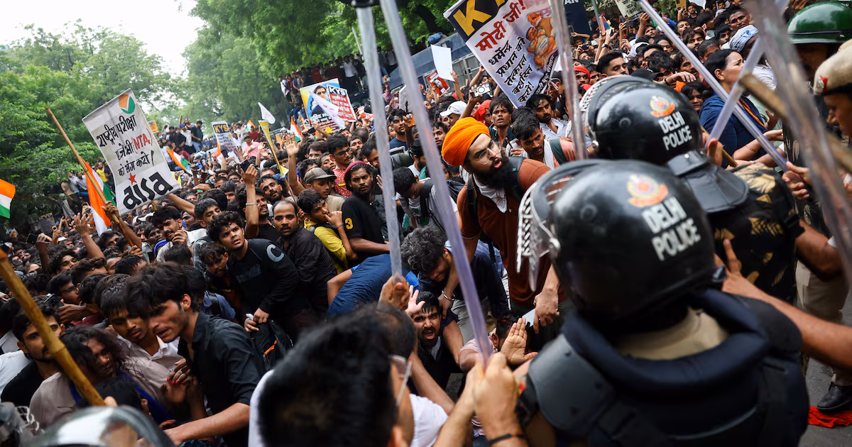 Supporters of India's Cockroach Janta Party scuffle with police outside parliament