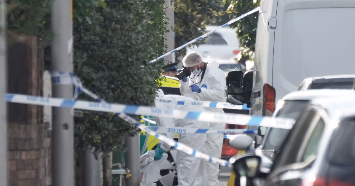 Forensic officers at the scene of the stabbing attack in Southport carried out by Axel Rudakubana. Getty Images