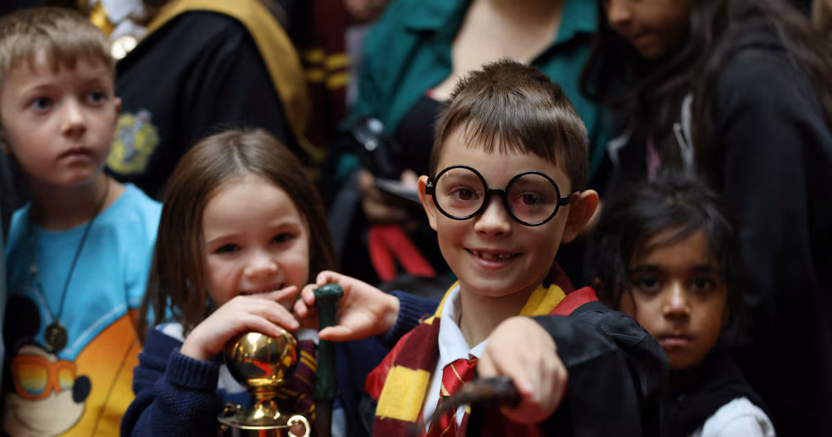A Harry Potter fan in London holds a wand during Back to Hogwarts Day, held annually on September 1. Reuters