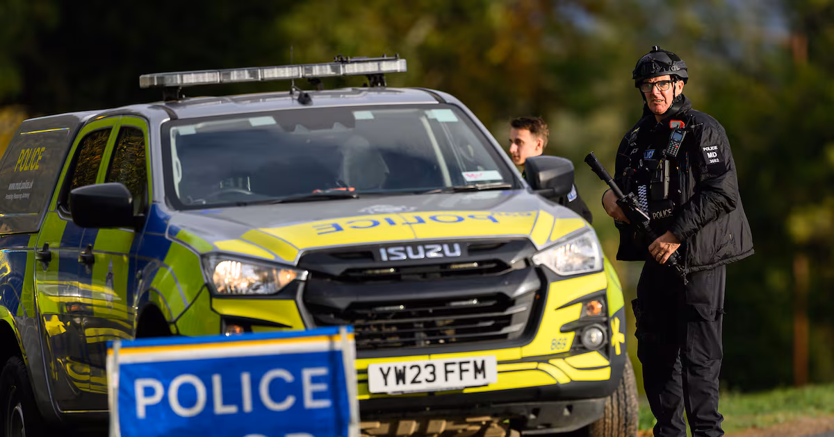 Armed police maintain road blocks and security checks around RAF Fairford
