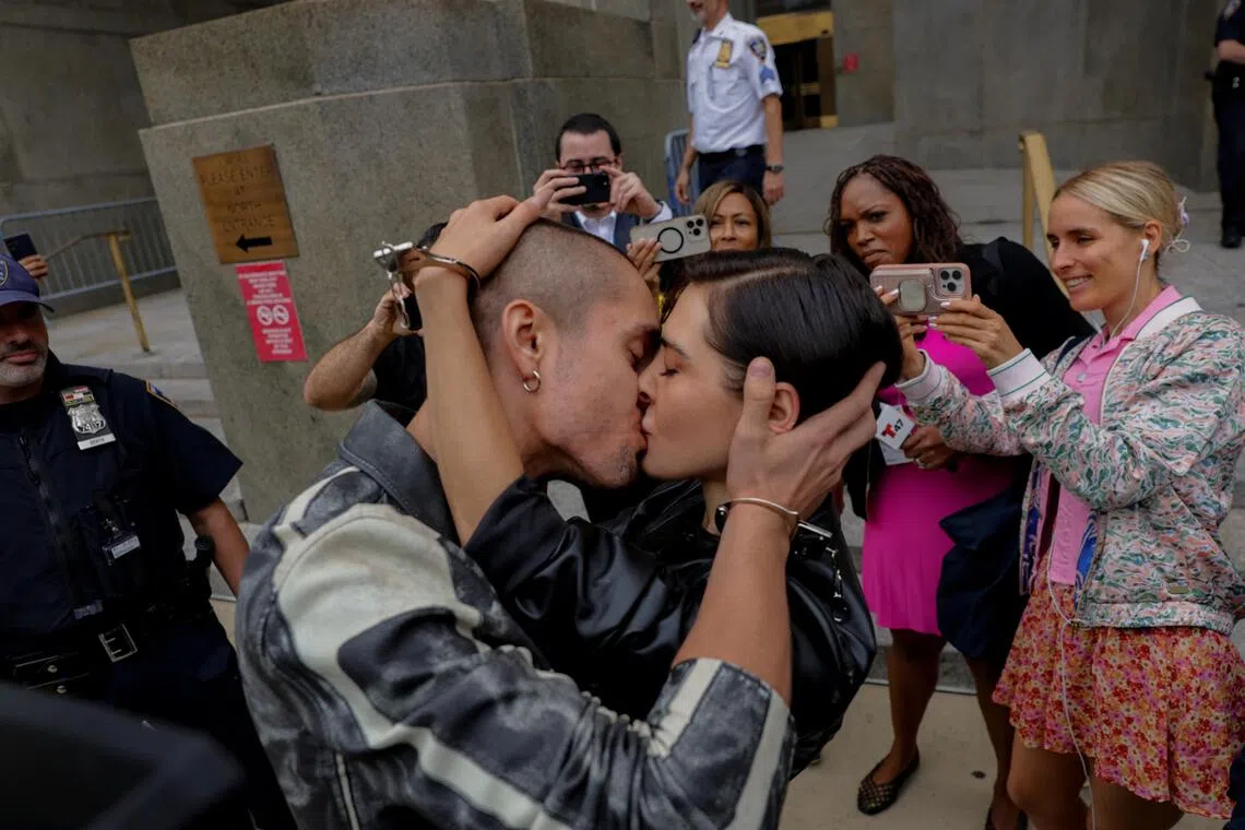 Empire State Building climbers kiss outside court after viral proposal