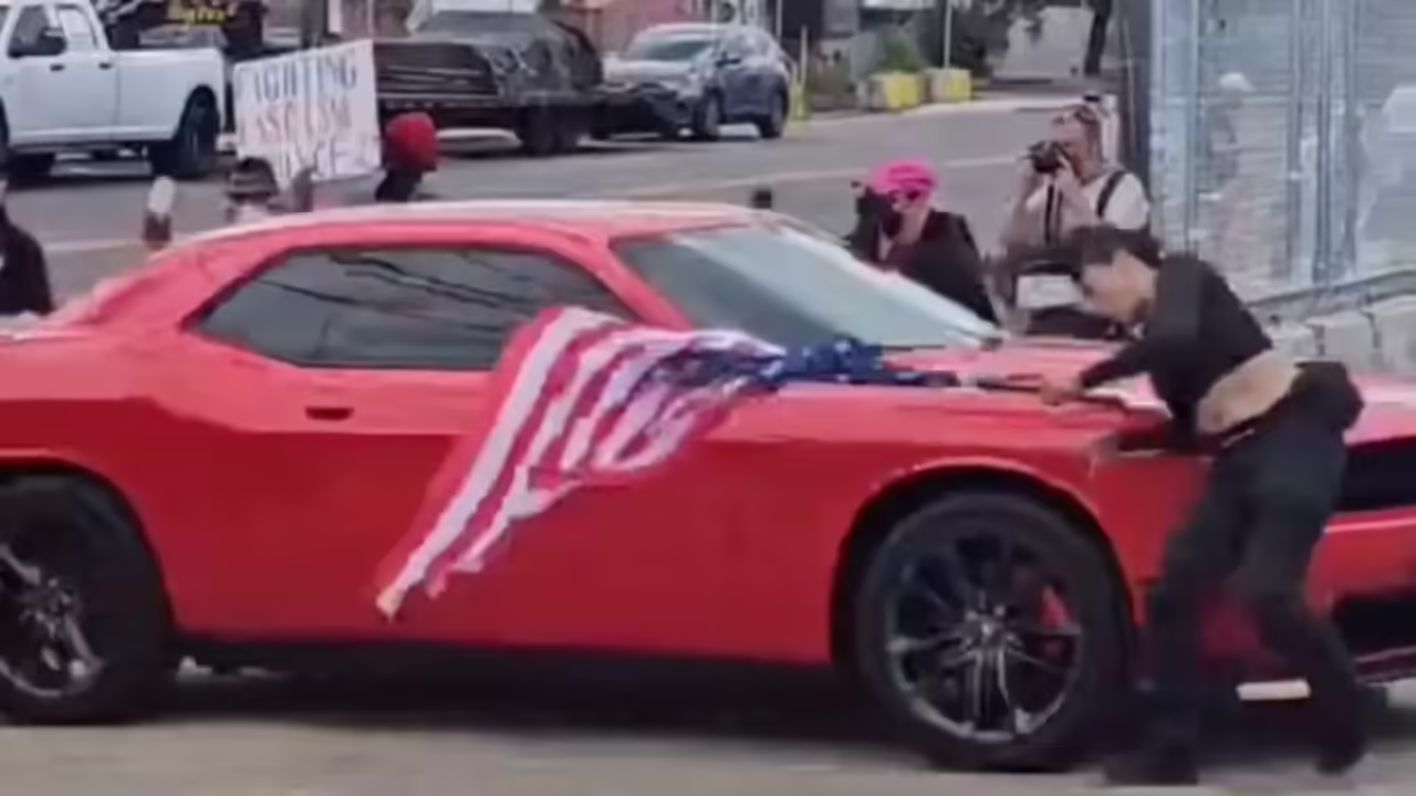 Anti-ICE protester waving upside-down flag hit by car in New Jersey