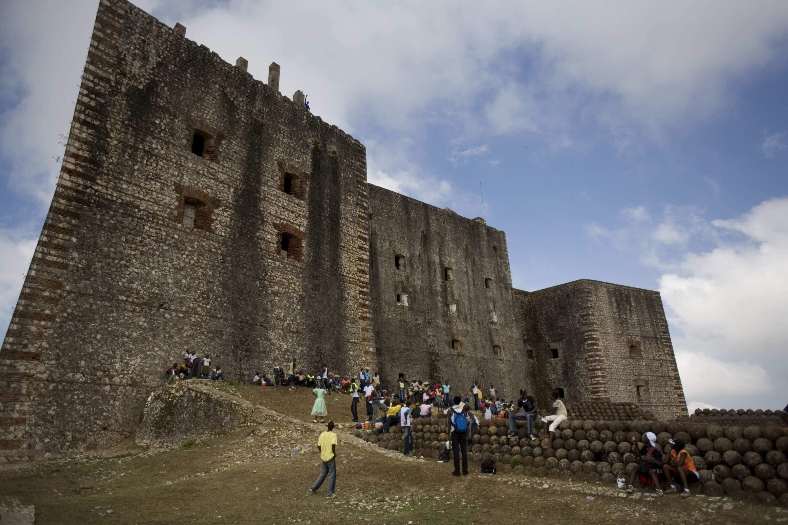 A stampede at a Haitian mountaintop fortress kills at least 25 people and injures dozens