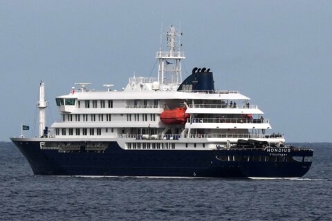 {Dutch officials say about 40 passengers from cruise ship hit by deadly hantavirus outbreak have disembarked on St. Helena} (CORRECTS: A previous APNewsAlert erroneously reported
