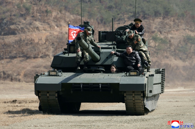 North Korean leader, daughter try out new tank