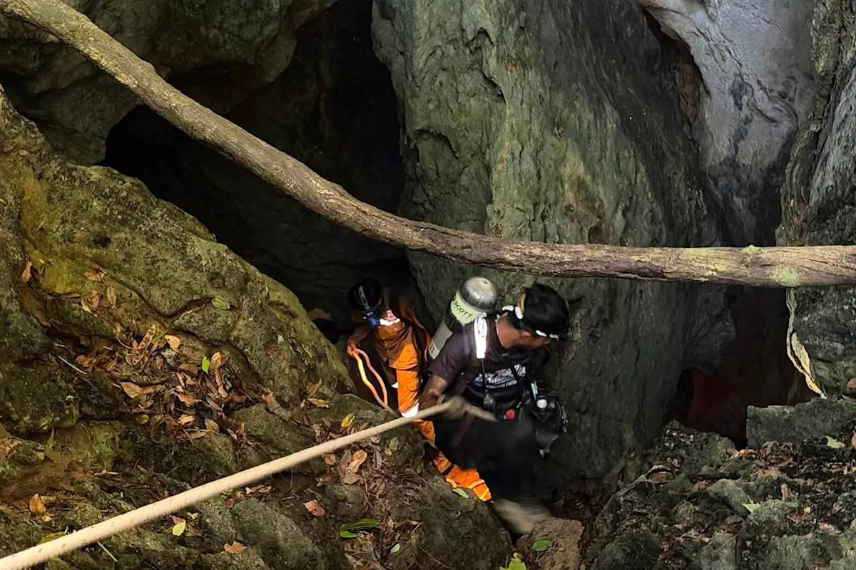 Heavy rains threaten to delay search for 2 people missing in Laos cave