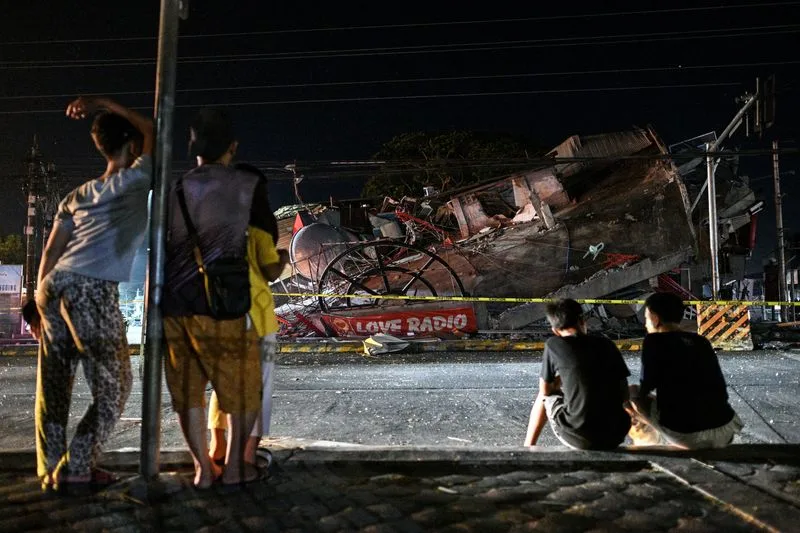 Rescuers race to reach trapped after powerful quake in southern Philippines