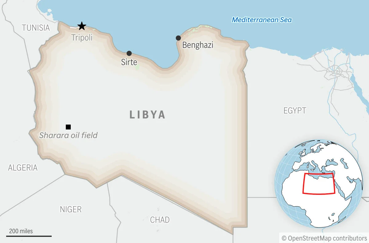 A boat carrying migrants capsizes off Libya's coast, with at least 50 dead or missing