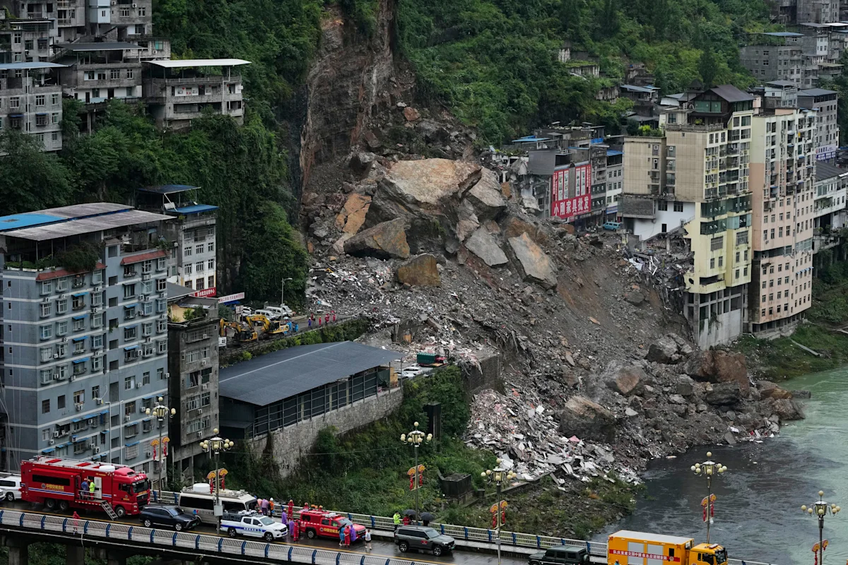 Rescuers race to find survivors in the rain after a landslide in China kills at least 8