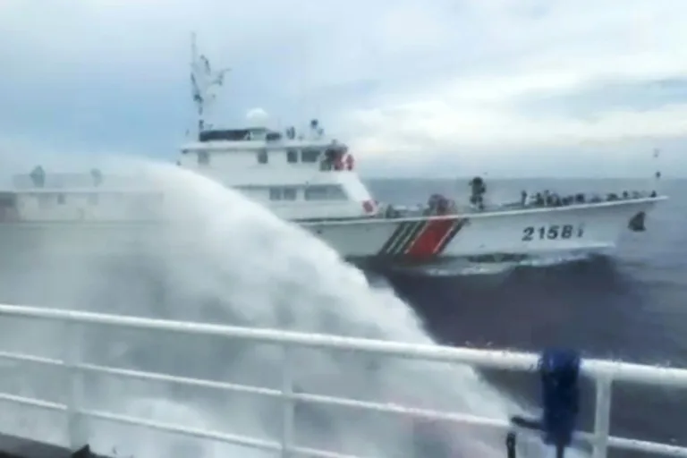 Philippines says ship hit by Chinese water cannon at disputed reef