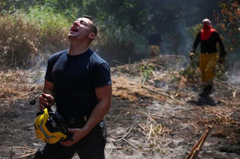 Three Greek firefighters killed as wildfires strike further east in Europe