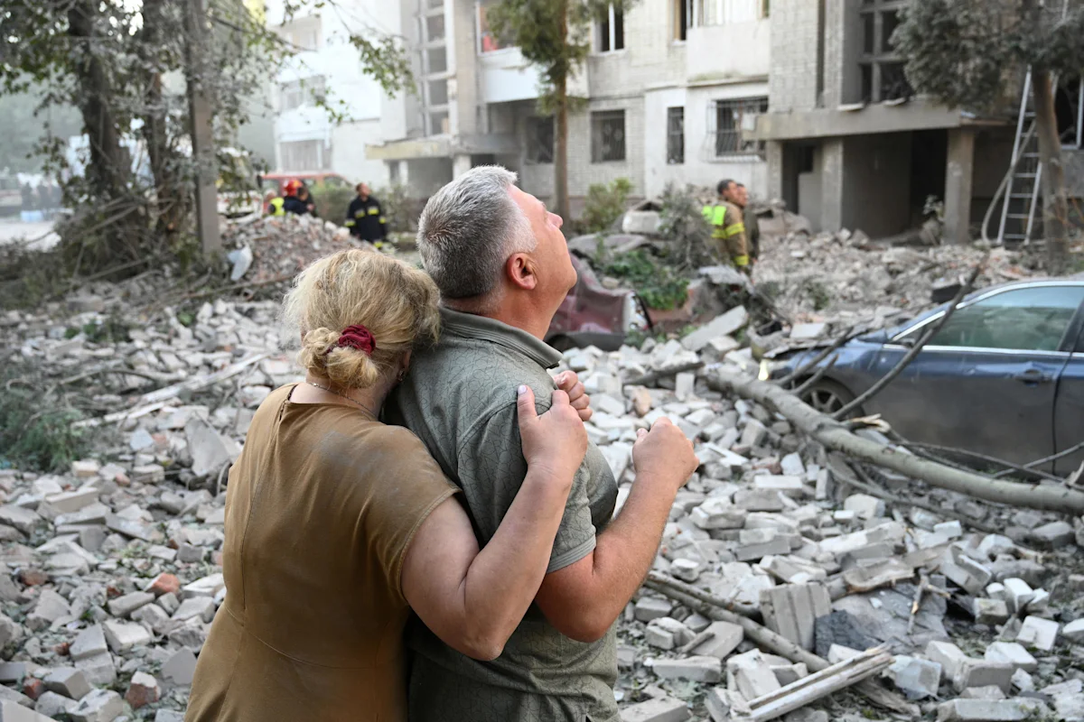 Russian attacks on Ukraine kill at least eight, may have violated Polish airspace