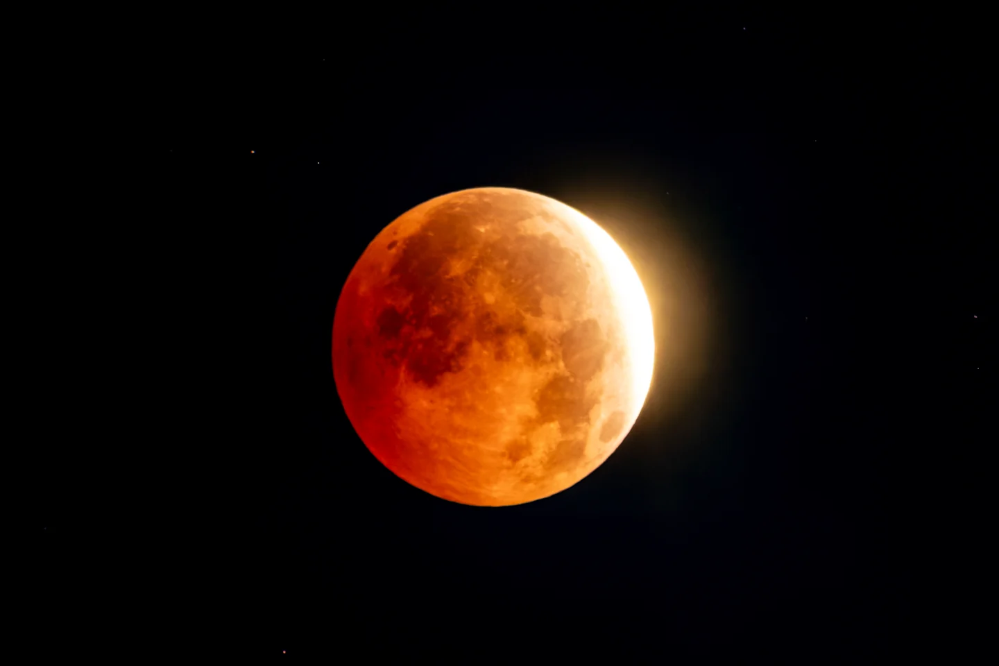 Near-total lunar eclipse turns moon deep red in stunning photos from around the world