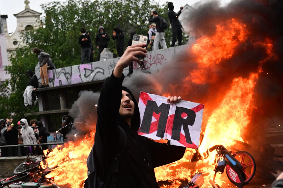 Rioters clash with Brussels police during protest against budget cuts