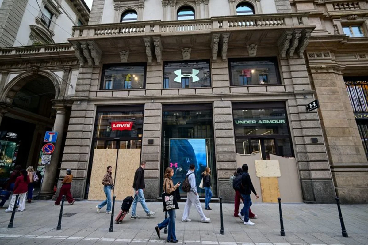 Milan luxury shops close for fear of new unrest as government prepares to deploy troops
