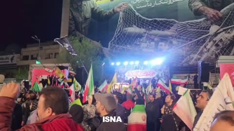 Iranians cheer as air defense systems activate in Tehran