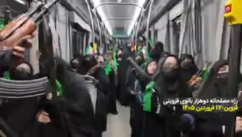 Iranian women march armed in Qazvin, showing patriotism.
